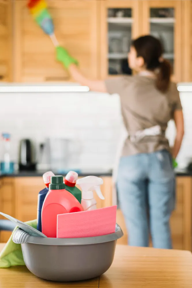 Woman cleaning a cabinet